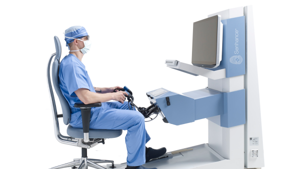 A doctor siting in a chair with a controller in their hand 